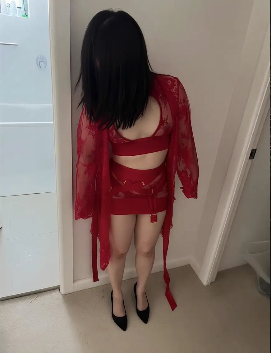 Erotic massage Sydney masseuse in a sheer red lace robe and black heels Erotic massage Sydney masseuse in a sheer red lace robe and black heels