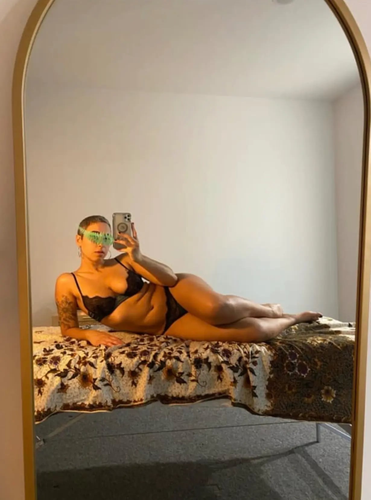 Prostate massage Melbourne, masseuse in black lace lying on her massage table Prostate massage Melbourne, masseuse in black lace lying on her massage table